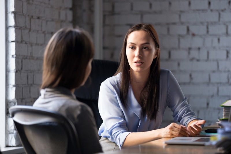 two women talking in the meeting