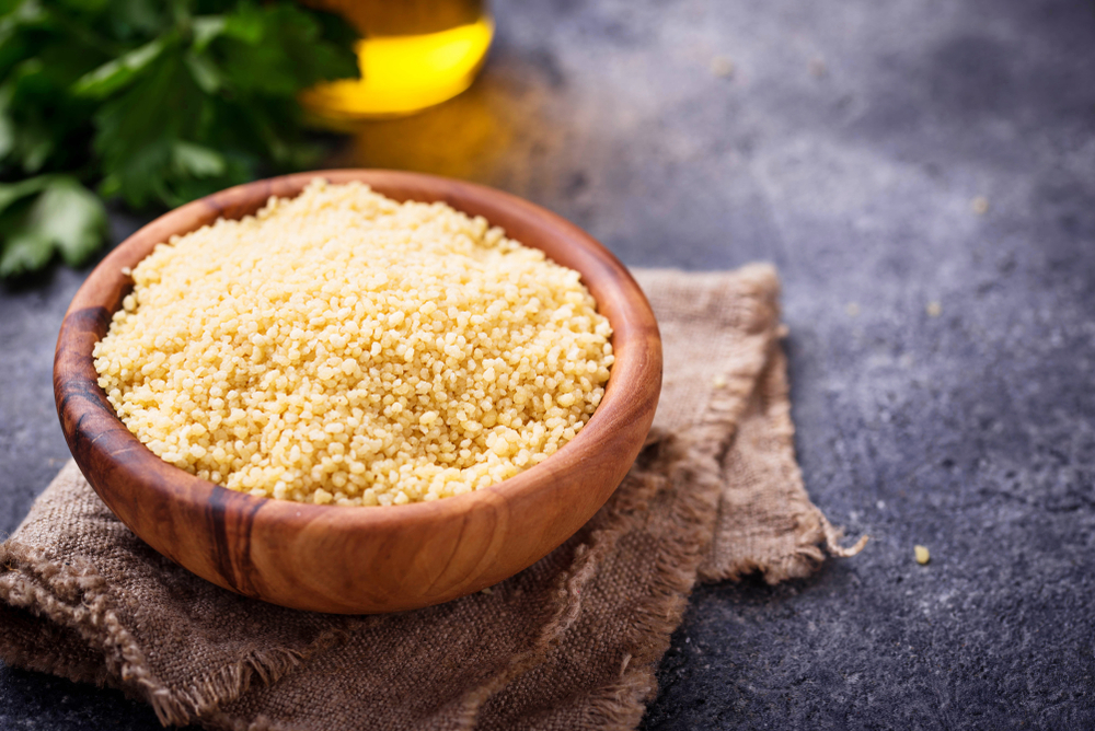 Couscous grain in wooden bow